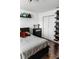 Bedroom with a bed, shelves, a dresser, and closet at 9221 Mountain Magnolia Dr, Riverview, FL 33578