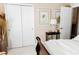 Cozy bedroom featuring a sleigh bed, closet, and decorative artwork at 9221 Mountain Magnolia Dr, Riverview, FL 33578