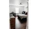 Bedroom with a window, a keyboard, a bed, and hardwood floors at 9221 Mountain Magnolia Dr, Riverview, FL 33578