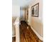 Second floor hallway showcasing polished wood floors, neutral walls, and classic trim at 9221 Mountain Magnolia Dr, Riverview, FL 33578