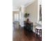 Hallway features dark wood floors and elegant wine storage, adding a touch of sophistication to the home at 9221 Mountain Magnolia Dr, Riverview, FL 33578