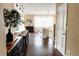 Hallway overlooking kitchen with marble countertop, stools, dining area and sitting room at 9221 Mountain Magnolia Dr, Riverview, FL 33578