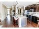 Modern kitchen featuring dark wood cabinets, granite countertops, stainless steel appliances and breakfast bar at 9221 Mountain Magnolia Dr, Riverview, FL 33578