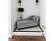 Cozy reading nook with a comfortable chaise lounge and decorative wall sconces at 9221 Mountain Magnolia Dr, Riverview, FL 33578