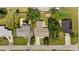 Aerial view showcases the property with a well-maintained roof and surrounding landscape at 2126 Hanby St, Port Charlotte, FL 33952