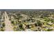 Wide aerial shot highlights the neighborhood featuring tree-lined streets and multiple ponds at 2126 Hanby St, Port Charlotte, FL 33952