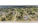 Panoramic aerial showcases homes within a lush, green and established neighborhood at 2126 Hanby St, Port Charlotte, FL 33952