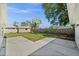 Spacious backyard with a concrete patio, a shed, and a wooden fence, perfect for outdoor entertaining at 2126 Hanby St, Port Charlotte, FL 33952