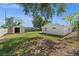 Expansive backyard showcasing a shed, green grass, and a charming setting for outdoor enjoyment at 2126 Hanby St, Port Charlotte, FL 33952