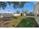 Backyard view showcasing the shed enclosed by a fence providing a secure and private outdoor area at 2126 Hanby St, Port Charlotte, FL 33952