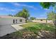 Well-maintained backyard features lush grass, a shed, and a concrete patio, offering a relaxing outdoor space at 2126 Hanby St, Port Charlotte, FL 33952