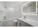 Bright bathroom features a shower-tub combo, illuminated mirror, and modern vanity at 2126 Hanby St, Port Charlotte, FL 33952