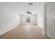 Bright bedroom with vinyl floors, a ceiling fan, a window, and a closet at 2126 Hanby St, Port Charlotte, FL 33952