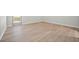 Bedroom featuring a sliding door access to the backyard and wood-look flooring at 2126 Hanby St, Port Charlotte, FL 33952