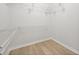 Walk-in closet with shelving and wood-look floors at 2126 Hanby St, Port Charlotte, FL 33952