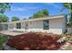 Charming single-story home featuring a well-manicured front yard with tasteful landscaping at 2126 Hanby St, Port Charlotte, FL 33952