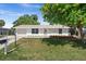 Charming single-story home with a well-manicured front lawn and attached garage at 2126 Hanby St, Port Charlotte, FL 33952