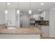 Remodeled kitchen with granite countertops, stainless steel appliances, and white cabinets at 2126 Hanby St, Port Charlotte, FL 33952