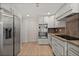 Modern kitchen features stainless steel appliances, white cabinets, and granite countertops at 2126 Hanby St, Port Charlotte, FL 33952