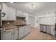 Modern kitchen features stainless steel appliances, white cabinets, and granite countertops at 2126 Hanby St, Port Charlotte, FL 33952