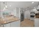 Remodeled kitchen with granite countertops and stainless steel appliances at 2126 Hanby St, Port Charlotte, FL 33952