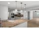 Kitchen with granite countertops, stainless steel appliances, and stylish pendant lighting at 2126 Hanby St, Port Charlotte, FL 33952