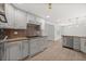 Bright kitchen featuring gray cabinets, granite countertops, and stainless steel appliances at 2126 Hanby St, Port Charlotte, FL 33952