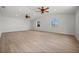Bright living room with vaulted ceiling, ceiling fans, and wood-look floors at 2126 Hanby St, Port Charlotte, FL 33952