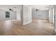 Open-concept living room with wood-look floors and lots of natural light at 2126 Hanby St, Port Charlotte, FL 33952