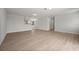 Bright living room with light wood flooring and an open layout, freshly painted at 2126 Hanby St, Port Charlotte, FL 33952