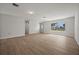 Bright living room with light wood flooring and a window, freshly painted at 2126 Hanby St, Port Charlotte, FL 33952