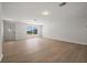 Bright living room with light wood flooring and a large window at 2126 Hanby St, Port Charlotte, FL 33952