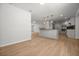 Open layout showcasing a remodeled kitchen and living room area with wood flooring at 2126 Hanby St, Port Charlotte, FL 33952