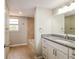 Bathroom with granite vanity, tub, shower, and tile flooring at 4266 Candler Ave, Spring Hill, FL 34609