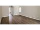 Spacious bedroom features beautiful wood-look flooring and neutral paint, creating a serene atmosphere at 4266 Candler Ave, Spring Hill, FL 34609