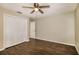 Comfortable bedroom with a ceiling fan, wood-look flooring, and a closet at 4266 Candler Ave, Spring Hill, FL 34609