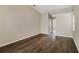Bright bedroom boasts wood-look flooring, neutral walls, and ample natural light, perfect for relaxation at 4266 Candler Ave, Spring Hill, FL 34609