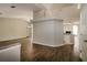 Open-concept living area with wood floors connecting the kitchen and dining spaces at 4266 Candler Ave, Spring Hill, FL 34609