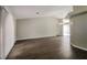 Spacious living room with hardwood floors and ample natural light from large window at 4266 Candler Ave, Spring Hill, FL 34609