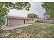Spacious backyard with a concrete patio and a wooden fence, perfect for outdoor activities and privacy at 5429 Flora Ave, Holiday, FL 34690