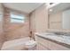 Bathroom features tile shower, tile floor, and granite vanity at 5429 Flora Ave, Holiday, FL 34690