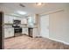 Bright kitchen featuring white cabinets, stainless steel appliances, and modern countertops at 5429 Flora Ave, Holiday, FL 34690