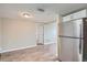 A spacious living area with wood-look floors, neutral walls, and great natural light at 5429 Flora Ave, Holiday, FL 34690