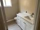 Bathroom vanity featuring a modern sink, granite counters and white cabinets at 12421 Early Run Ln, Riverview, FL 33578