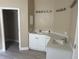 Updated bathroom with a double sink vanity, modern lighting, and ample counter space at 12421 Early Run Ln, Riverview, FL 33578