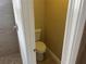 Bathroom with a toilet and tiled shower with neutral colored tiling at 12421 Early Run Ln, Riverview, FL 33578