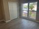 Bedroom with a large closet, window and light-colored flooring at 12421 Early Run Ln, Riverview, FL 33578