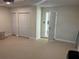 Spacious garage with epoxy flooring, multiple storage closets and an open door to interior at 12421 Early Run Ln, Riverview, FL 33578