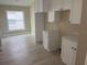 Bright kitchen area featuring modern cabinetry and sleek countertops at 12421 Early Run Ln, Riverview, FL 33578