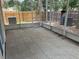 Relaxing screened patio with tile flooring and views of the backyard's wooden fence for privacy at 12421 Early Run Ln, Riverview, FL 33578